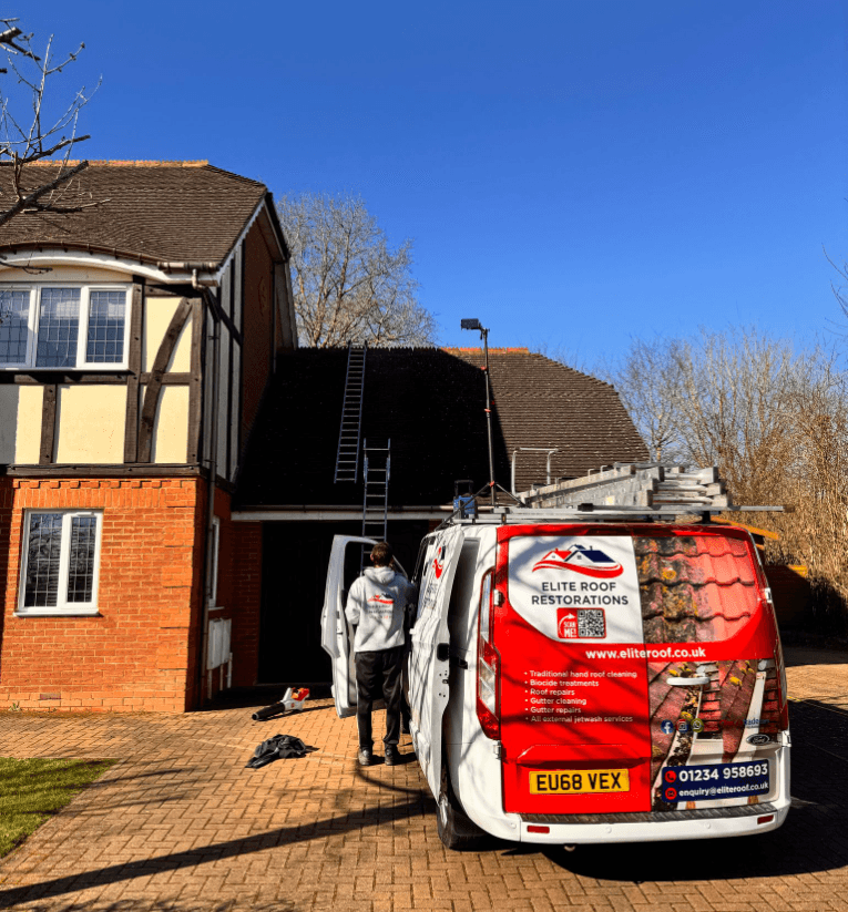 Roof cleaning technician at work